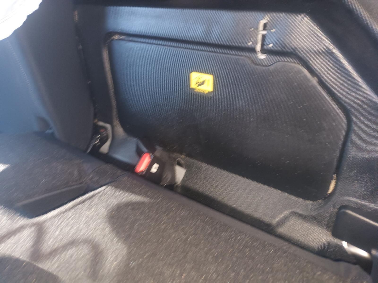 The Back Seat of a Car Has a Yellow Warning Sign on It — South West 4WD Wreckers in Harristown, QLD