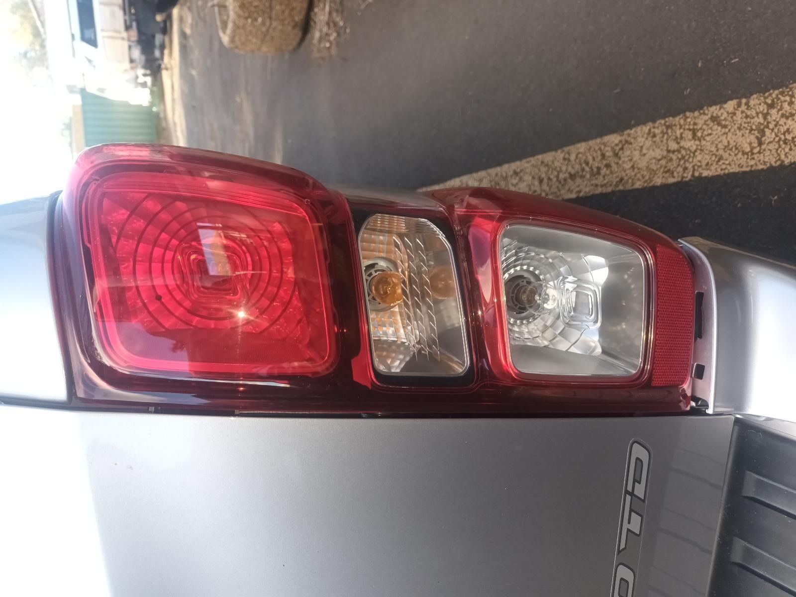 A Close Up of a Car 's Tail Light in a Parking Lot — South West 4WD Wreckers in Harristown, QLD