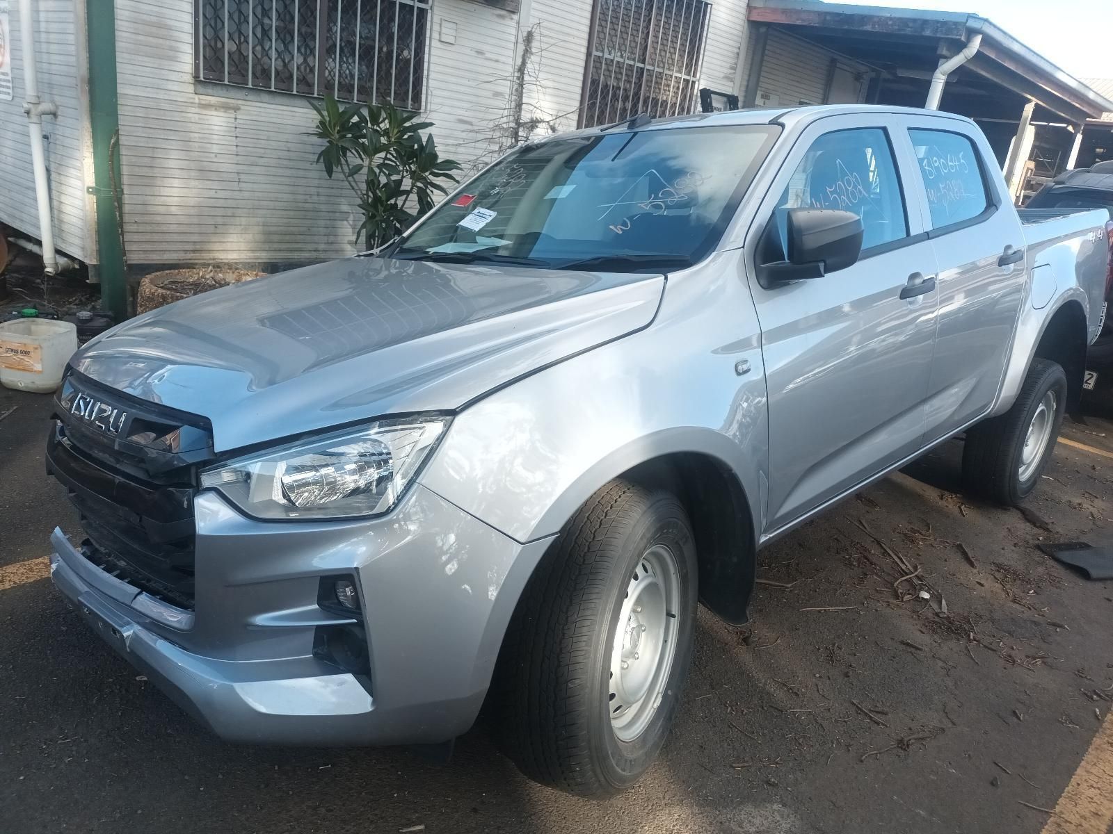 A Silver Pickup Truck is Parked in Front of a House — South West 4WD Wreckers in Harristown, QLD