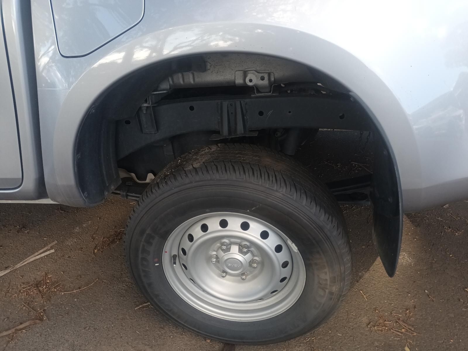 A Silver Truck is Parked on the Side of the Road — South West 4WD Wreckers in Harristown, QLD