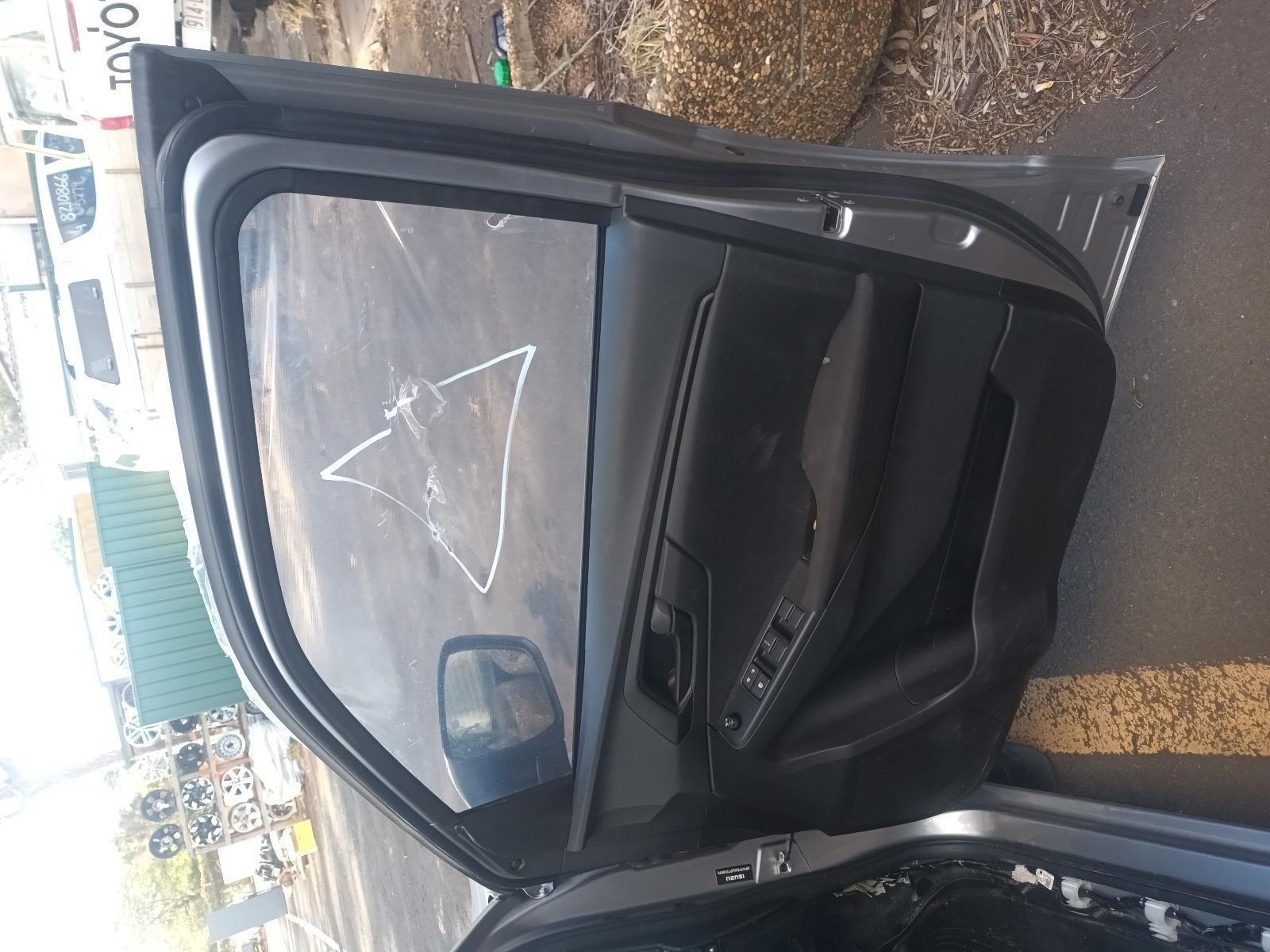 A Car with the Door Open and a Triangle Drawn on the Side of It — South West 4WD Wreckers in Harristown, QLD