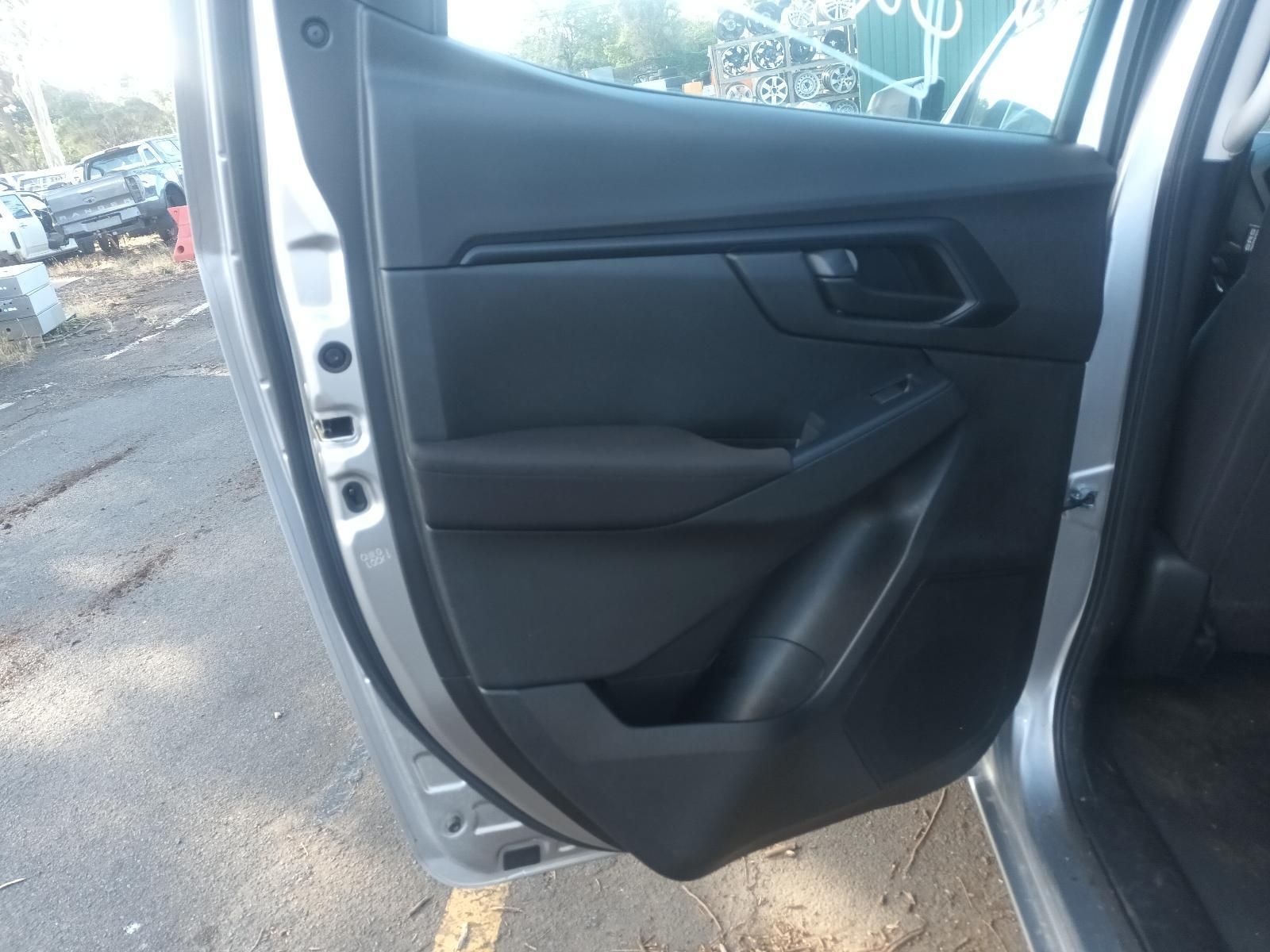 A Silver Car with the Door Open is Parked on the Side of the Road — South West 4WD Wreckers in Harristown, QLD