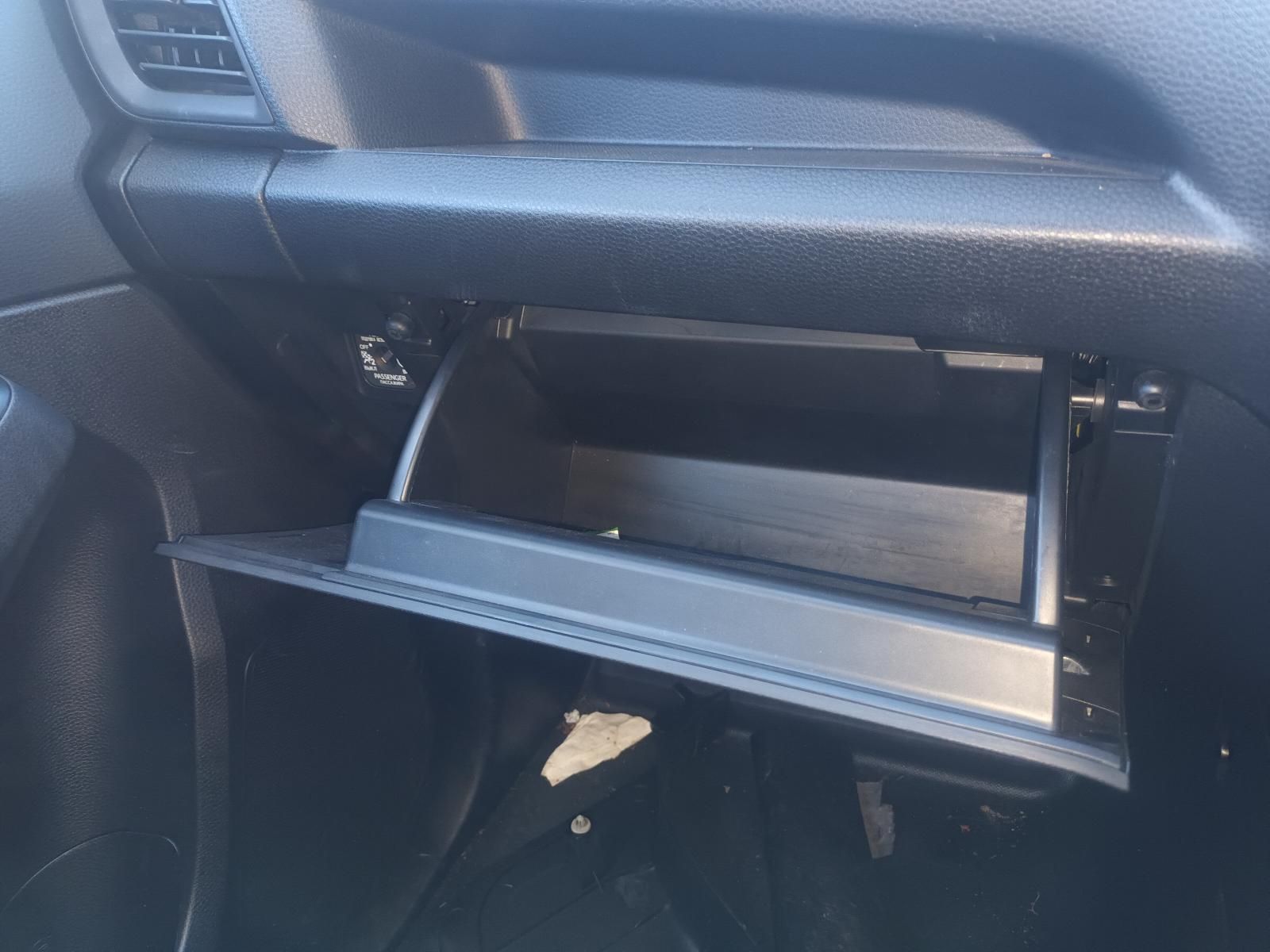 The Glove Box of a Car is Open and Empty — South West 4WD Wreckers in Harristown, QLD