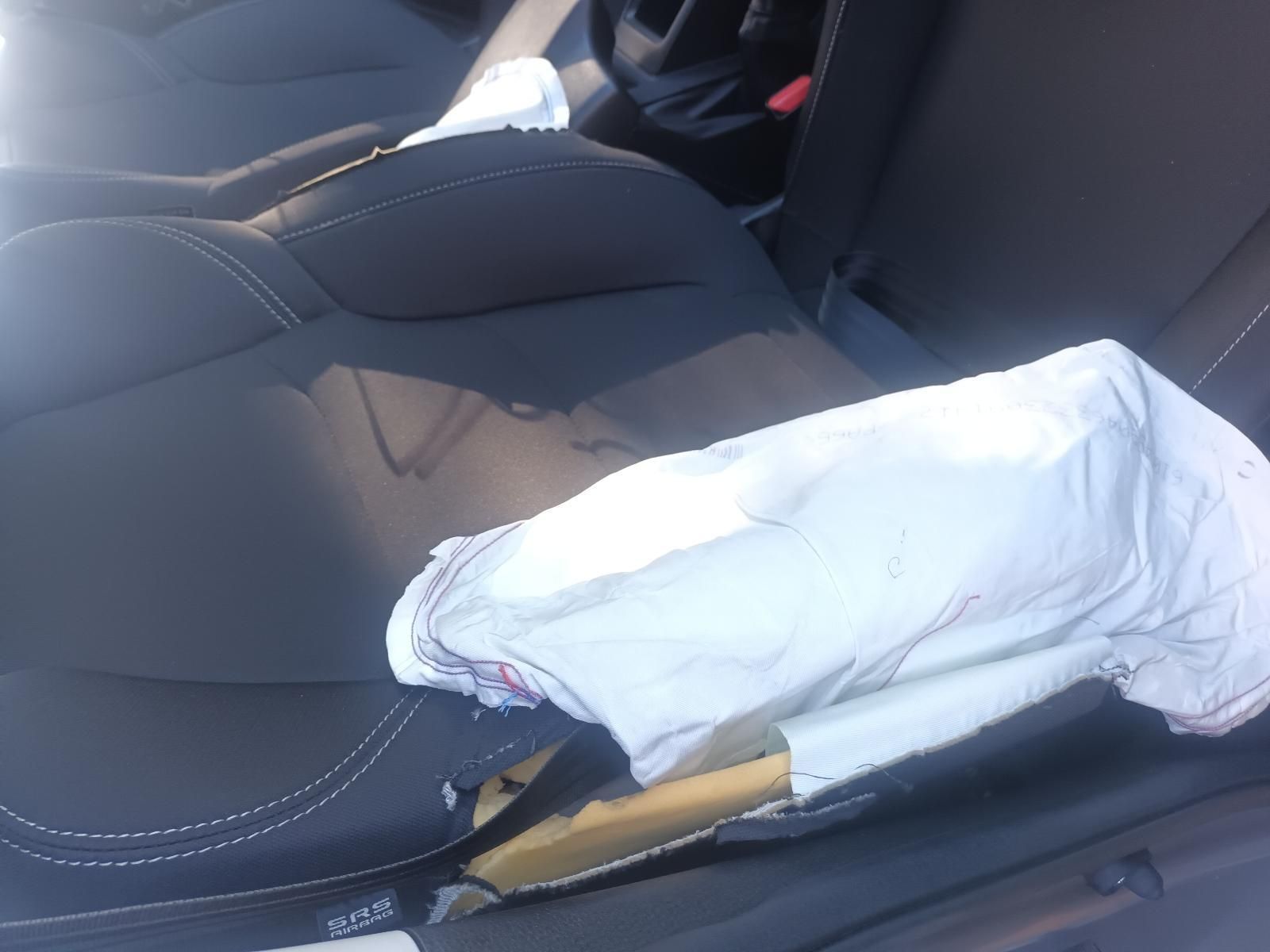 A Black Car Seat with a White Airbag on It — South West 4WD Wreckers in Harristown, QLD