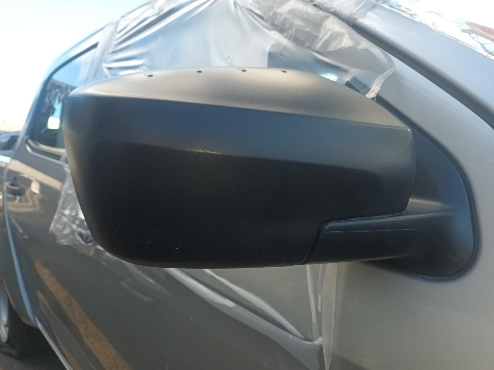 A Side View Mirror on a Car is Wrapped in Plastic — South West 4WD Wreckers in Harristown, QLD