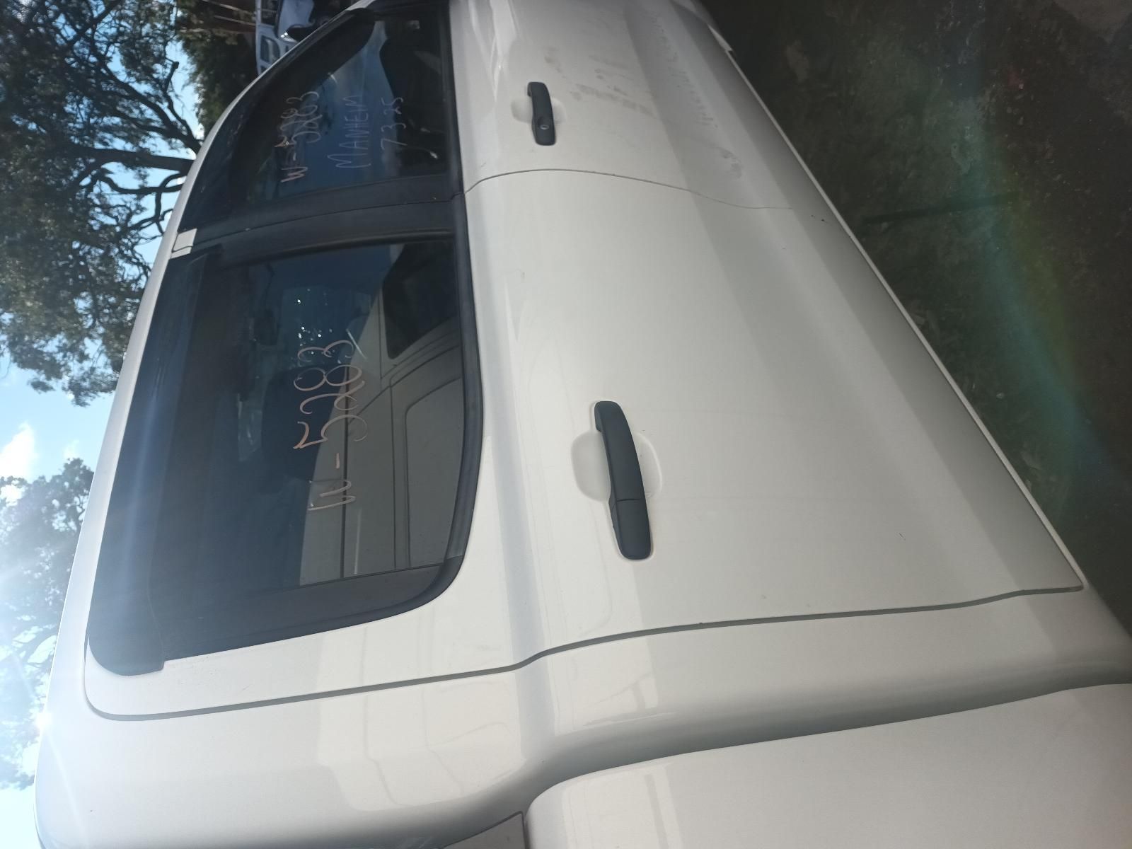 A White Truck is Parked on the Side of the Road — South West 4WD Wreckers in Harristown, QLD