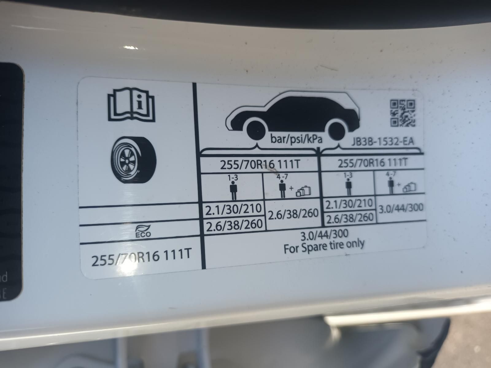 A Close Up of a Tire Pressure Sticker on a Car — South West 4WD Wreckers in Harristown, QLD