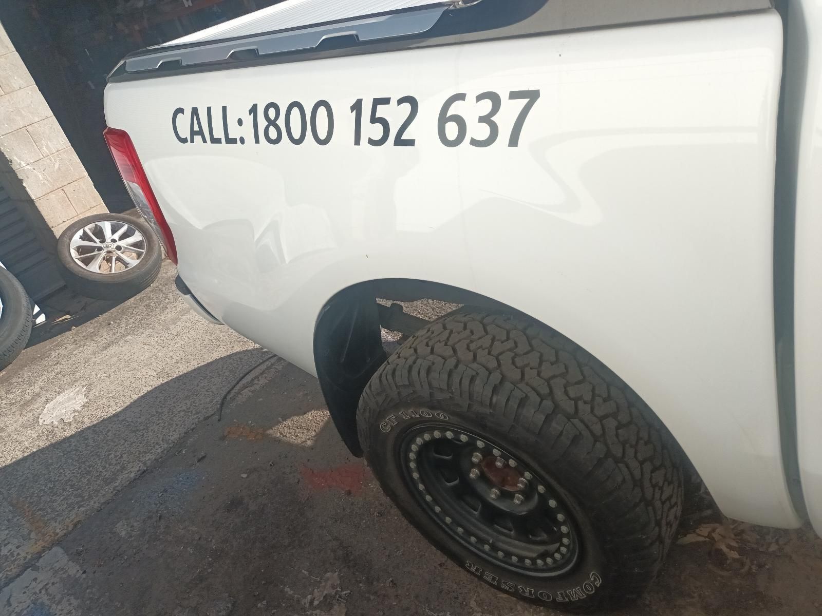 A White Truck with the Number 1800 152 637 on the Back — South West 4WD Wreckers in Harristown, QLD