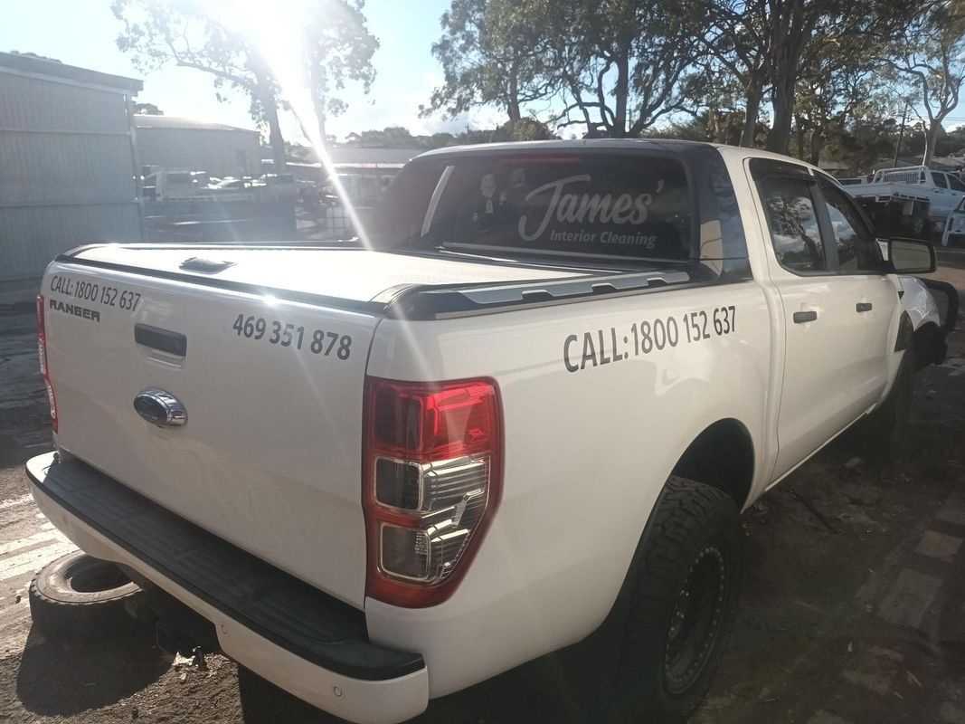 A White Pickup Truck is Parked in a Parking Lot — South West 4WD Wreckers in Harristown, QLD