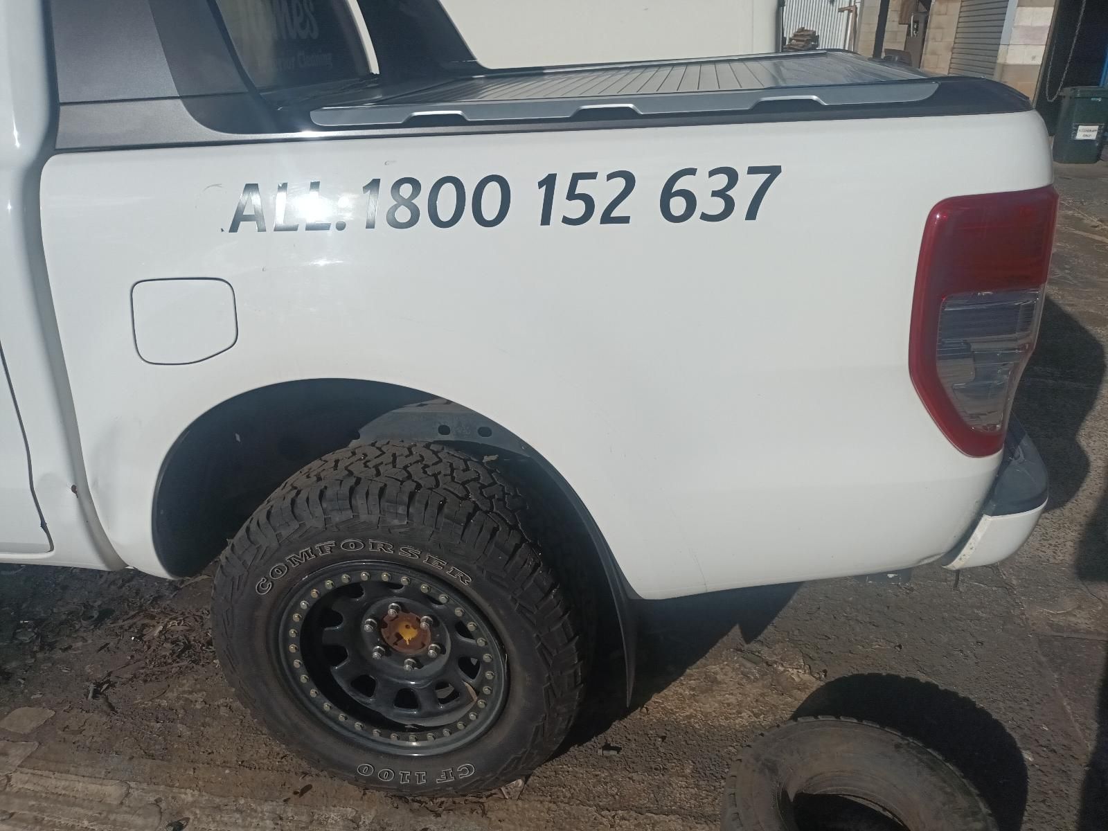 A White Truck with the Number 1800 152 637 on the Back — South West 4WD Wreckers in Harristown, QLD