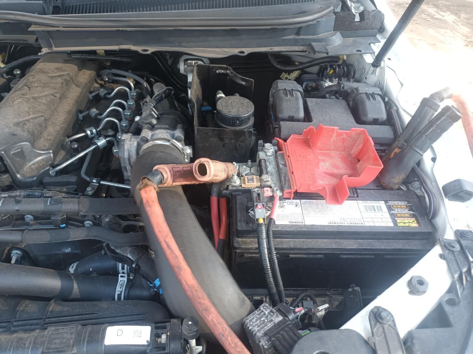 A Close Up of a Car Engine with a Battery in It — South West 4WD Wreckers in Harristown, QLD
