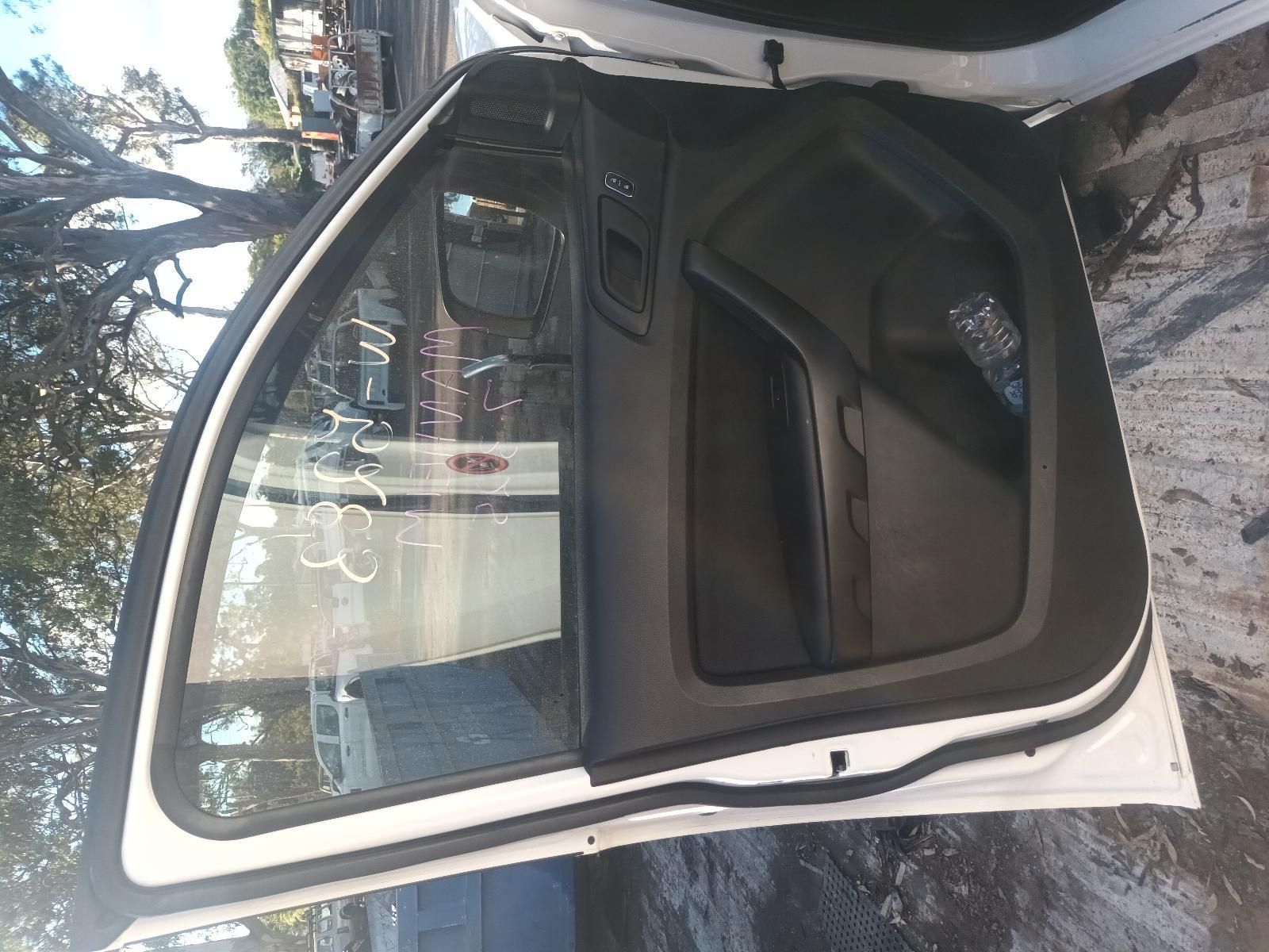 A White Car with the Door Open is Parked on the Side of the Road — South West 4WD Wreckers in Harristown, QLD