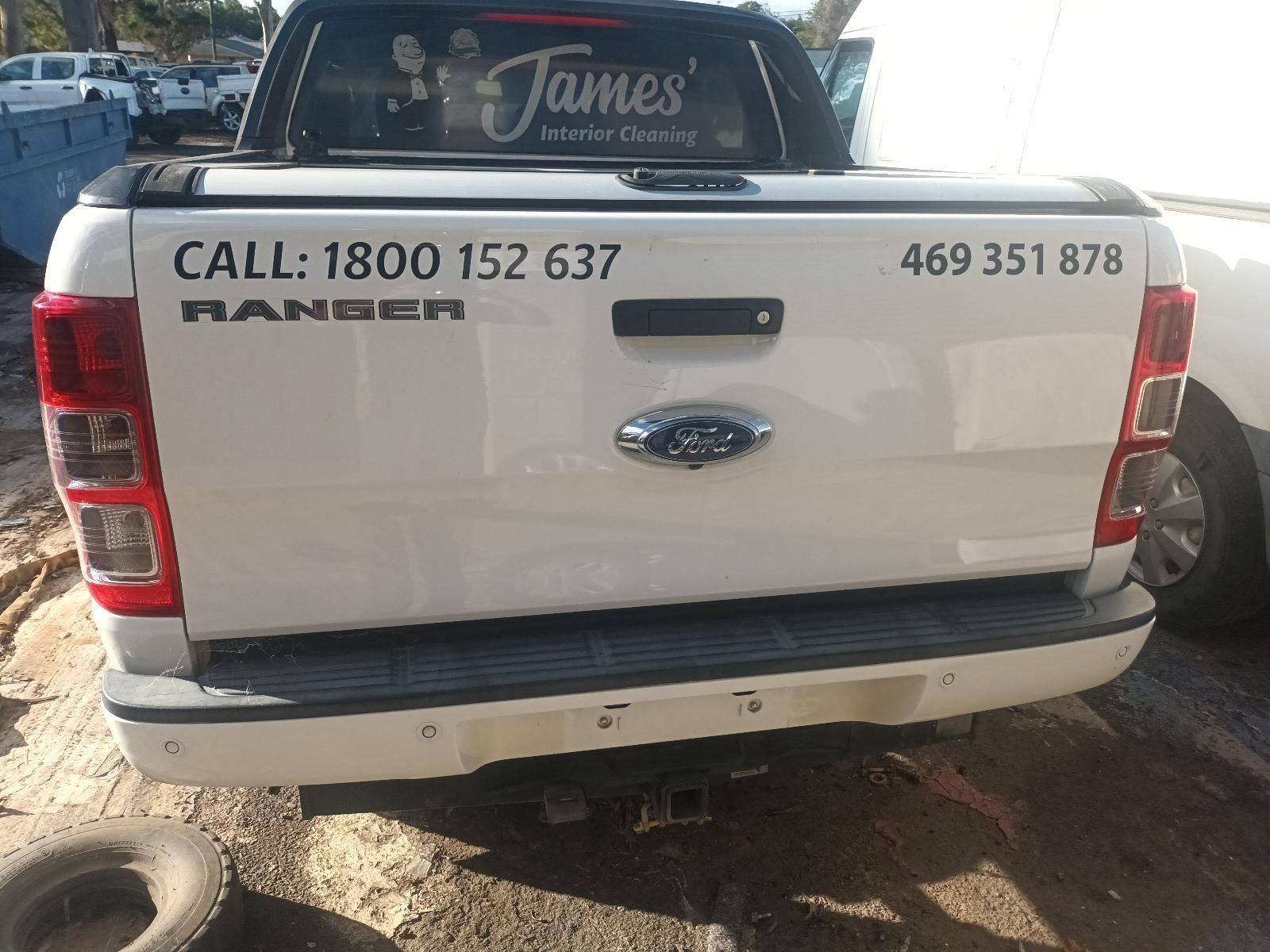 A White Ford Ranger Truck is Parked in a Parking Lot — South West 4WD Wreckers in Harristown, QLD