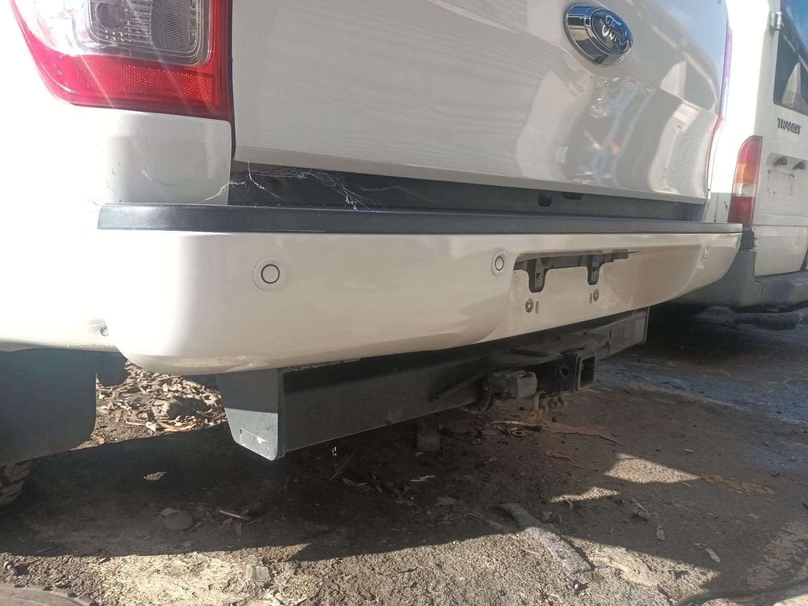 A White Truck with a Trailer Attached to It is Parked on the Side of the Road — South West 4WD Wreckers in Harristown, QLD