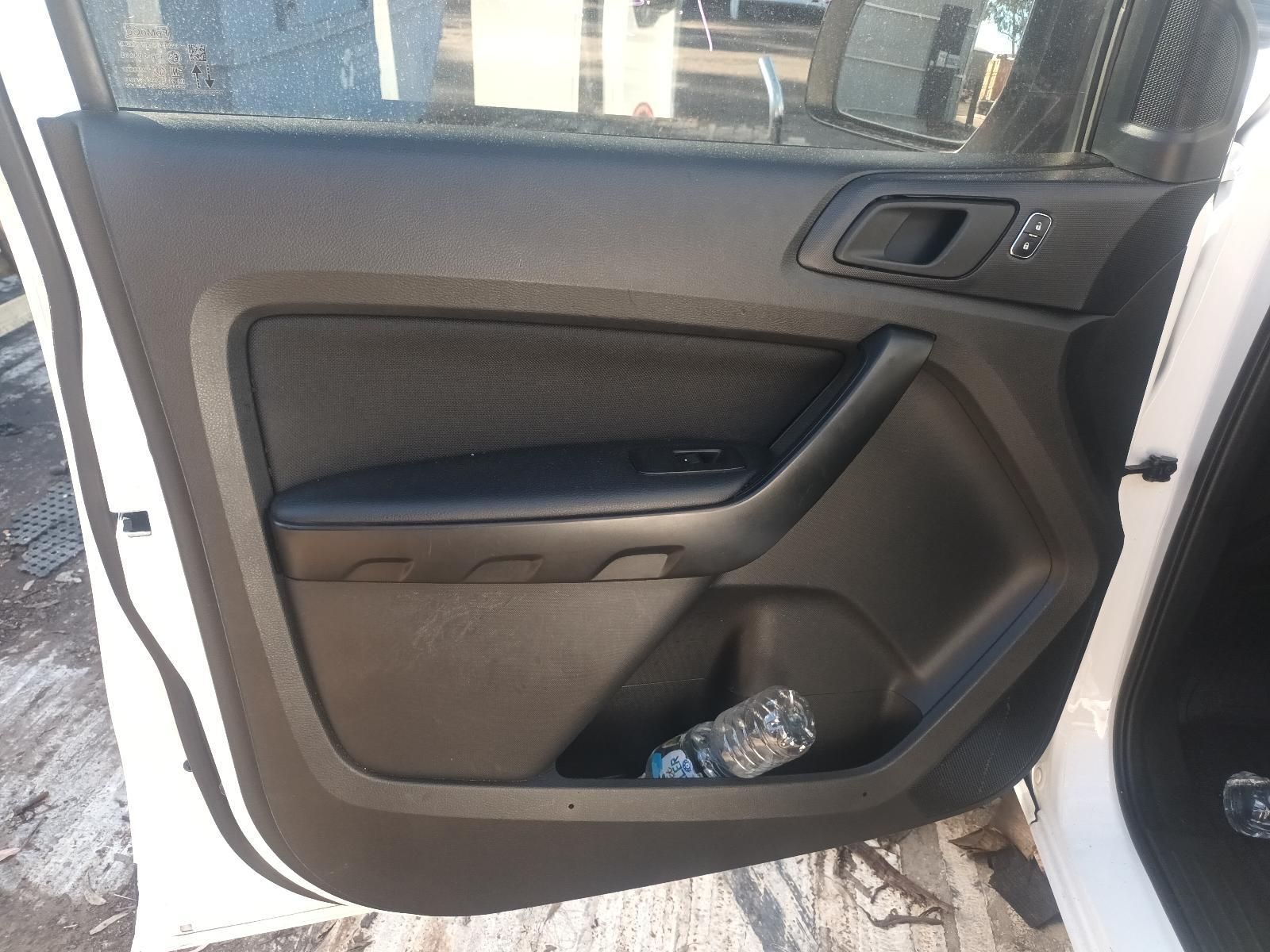 A White Car with the Door Open and a Bottle of Water in the Door Pocket — South West 4WD Wreckers in Harristown, QLD