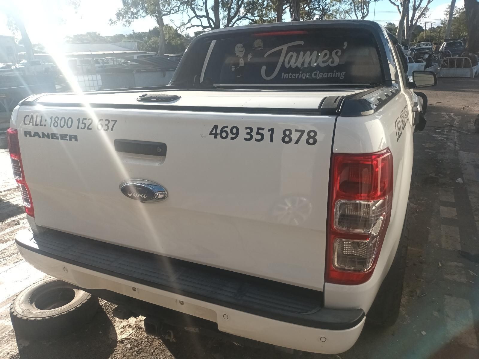 A White Ford Ranger Truck is Parked in a Parking Lot — South West 4WD Wreckers in Harristown, QLD