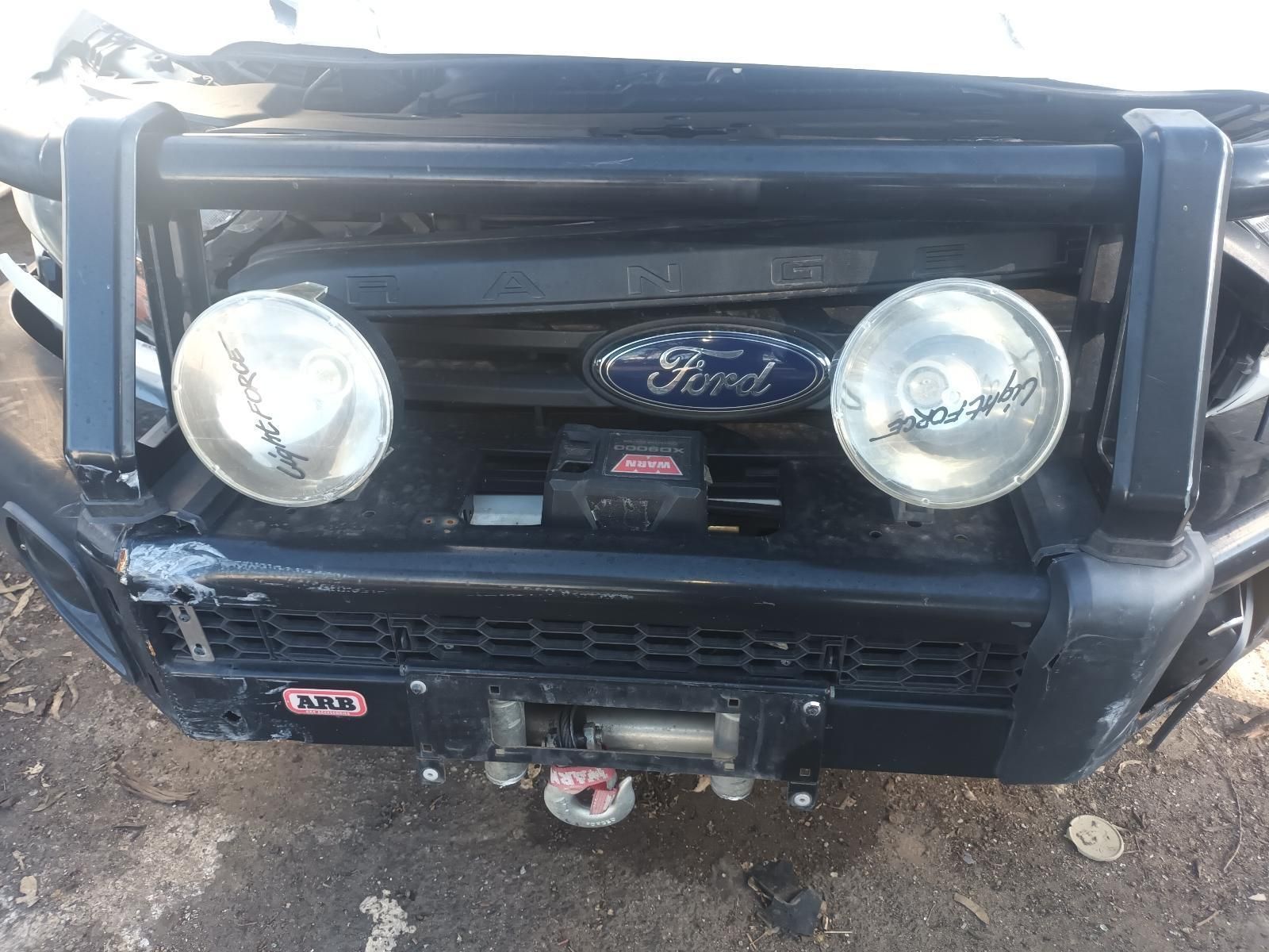 The Front Bumper of a Ford Truck with a Winch Attached to It — South West 4WD Wreckers in Harristown, QLD