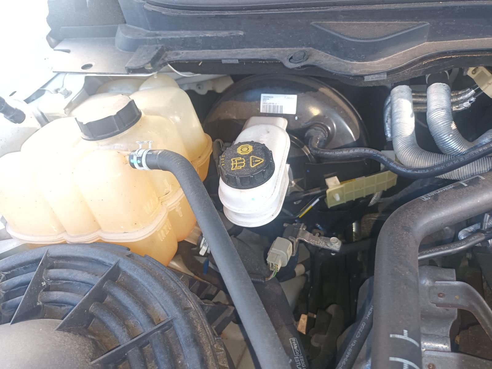 A Close Up of a Car Engine with a Brake Fluid Cap on It — South West 4WD Wreckers in Harristown, QLD