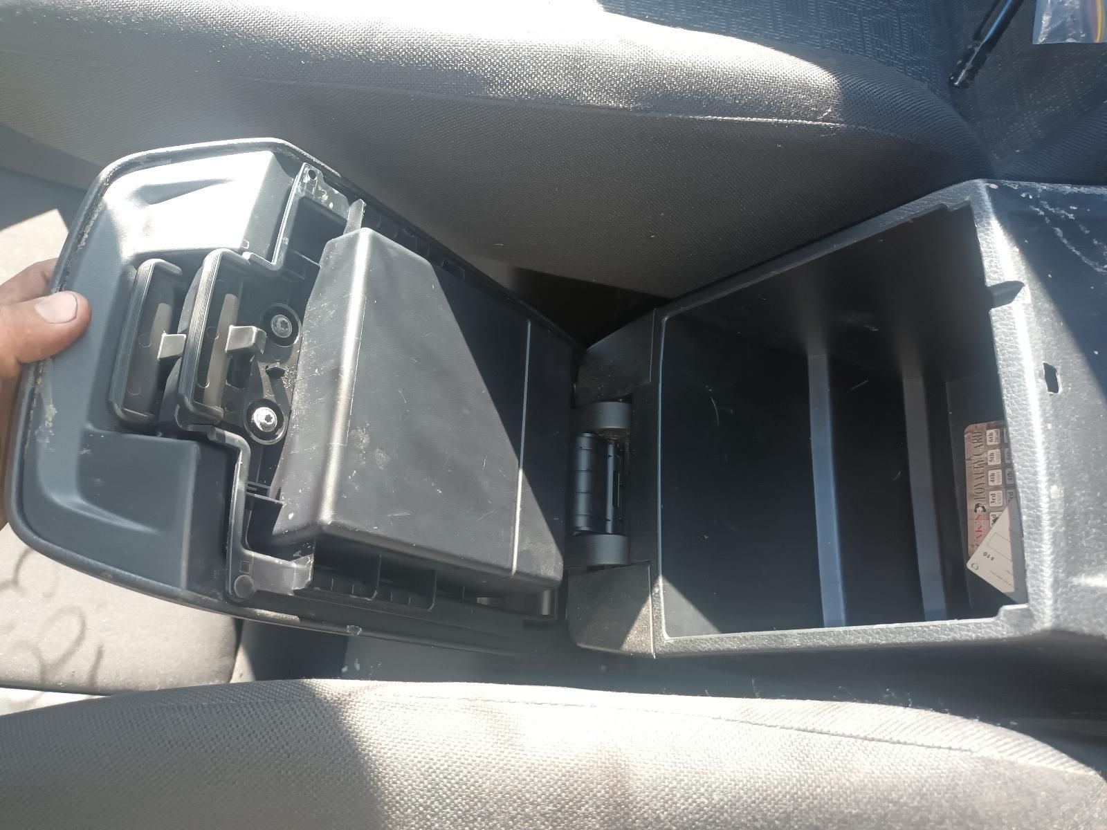 A Person is Holding the Arm Rest of a Car with the Lid Open — South West 4WD Wreckers in Harristown, QLD