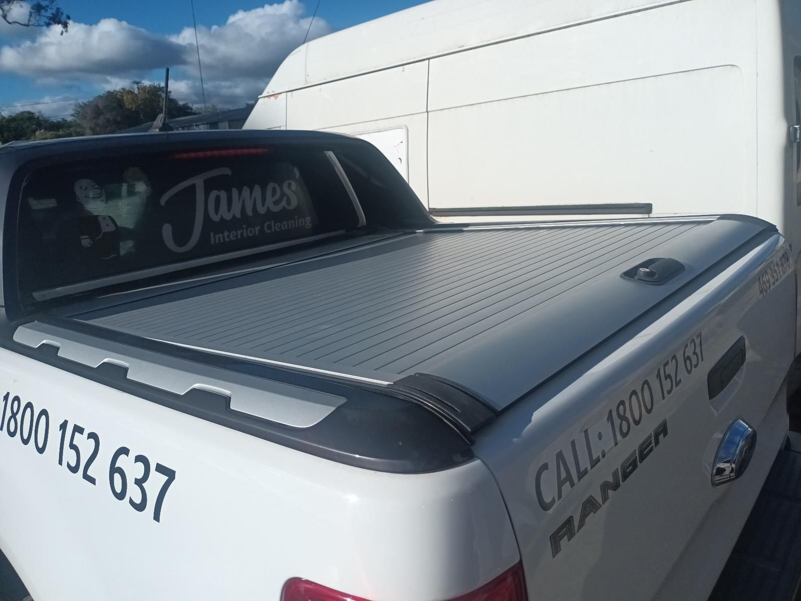 A White Truck with a James Advertisement on the Back — South West 4WD Wreckers in Harristown, QLD