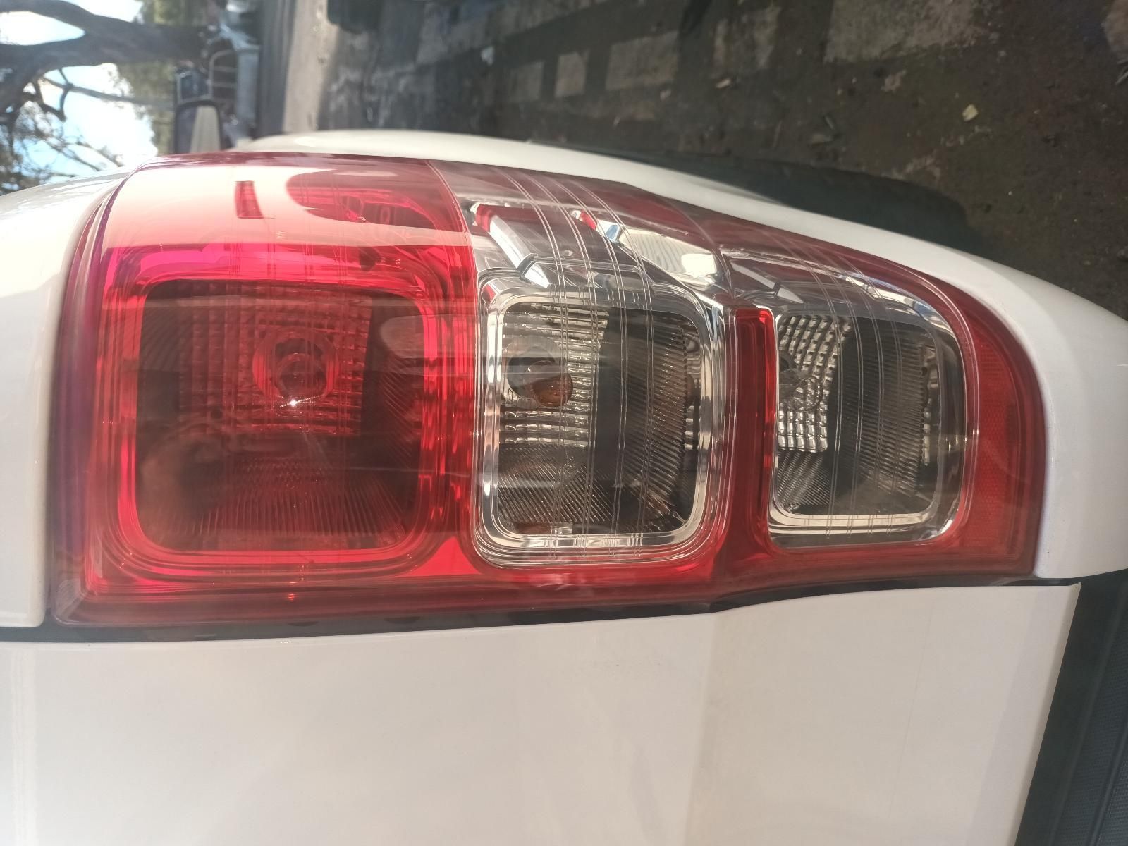 A Close Up of a White Car's Tail Light — South West 4WD Wreckers in Harristown, QLD