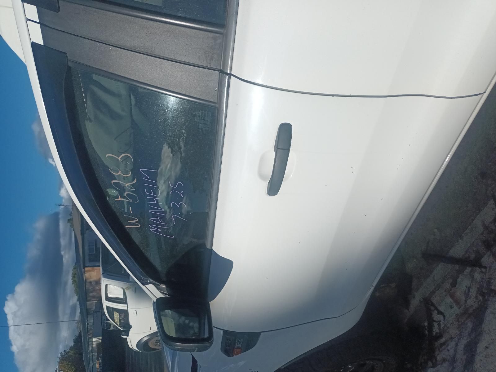 A White Car is Parked on the Side of the Road — South West 4WD Wreckers in Harristown, QLD