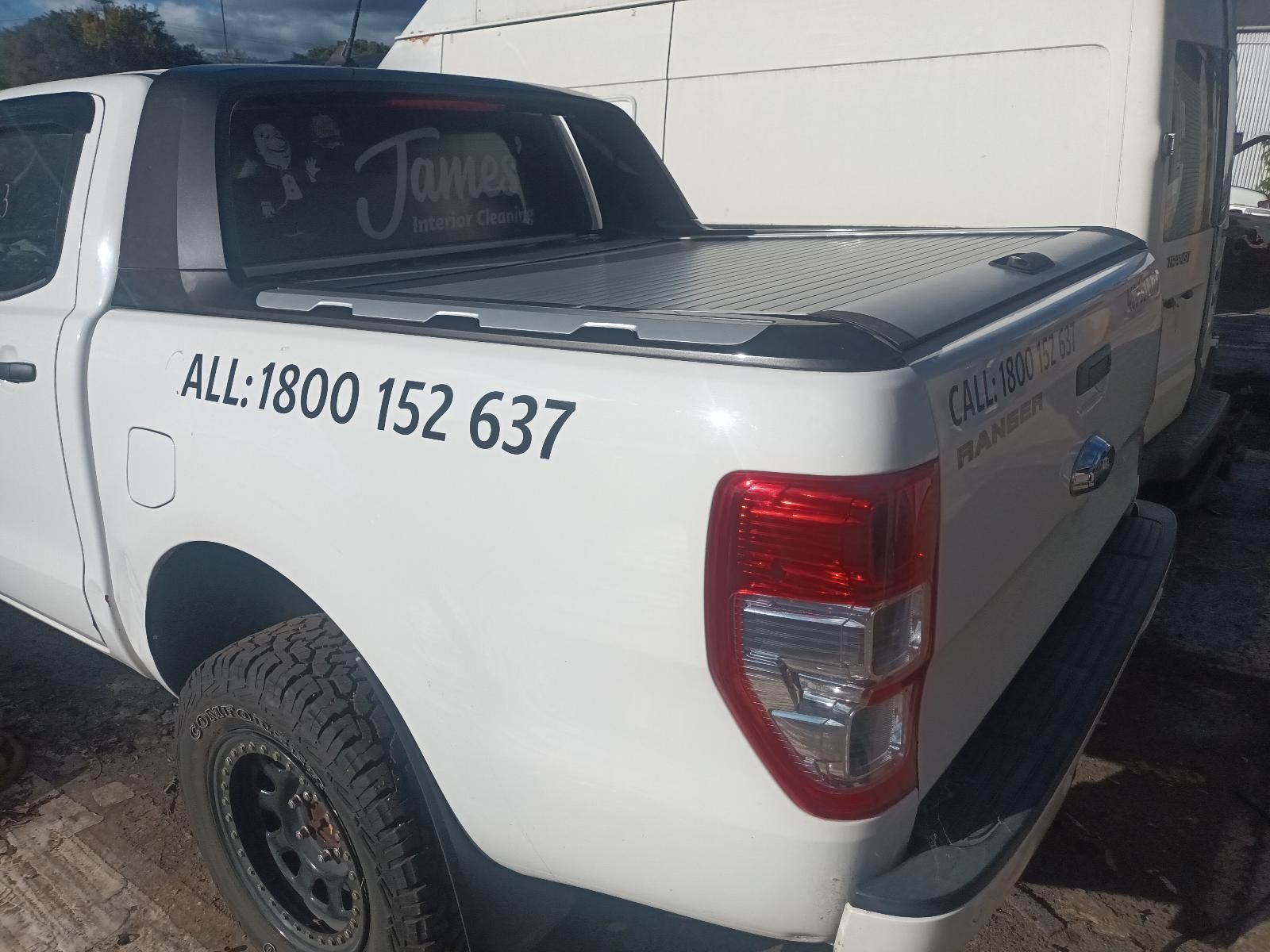 A White Truck with the Number 1800 152 637 on the Back — South West 4WD Wreckers in Harristown, QLD