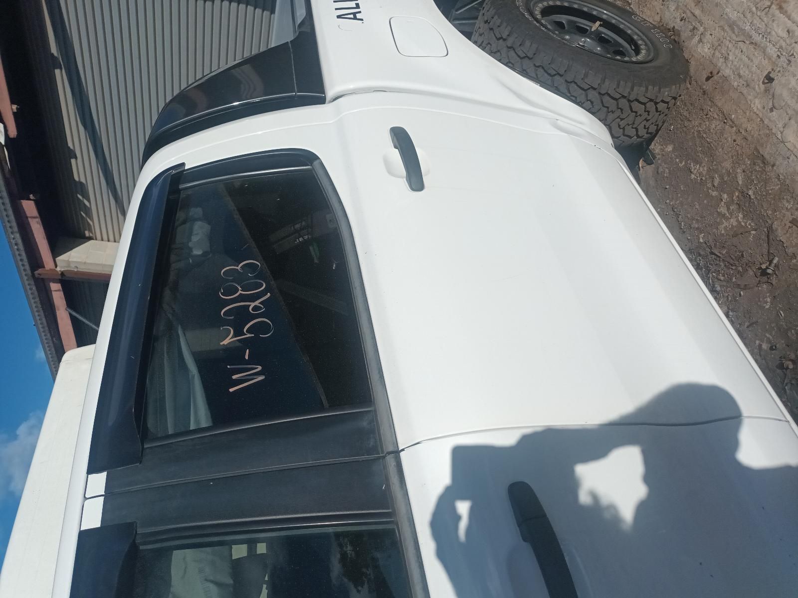 A White Truck with a Words and Number Witten on Window — South West 4WD Wreckers in Harristown, QLD