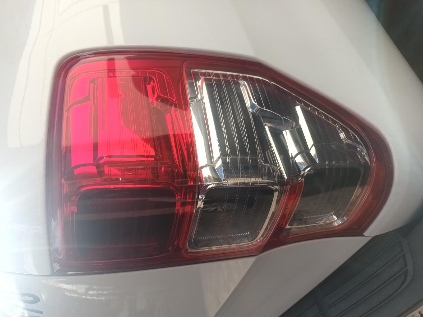 A Close Up of a Tail Light on a White Car — South West 4WD Wreckers in Harristown, QLD
