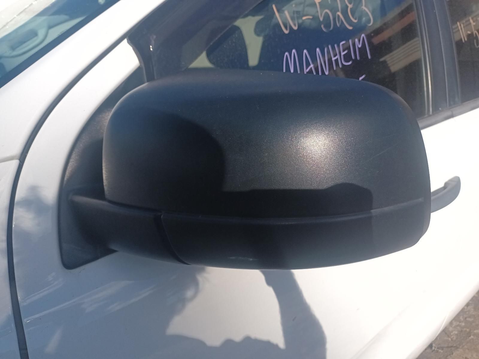 A Black Side Mirror on a White Car That Says Manheim — South West 4WD Wreckers in Harristown, QLD