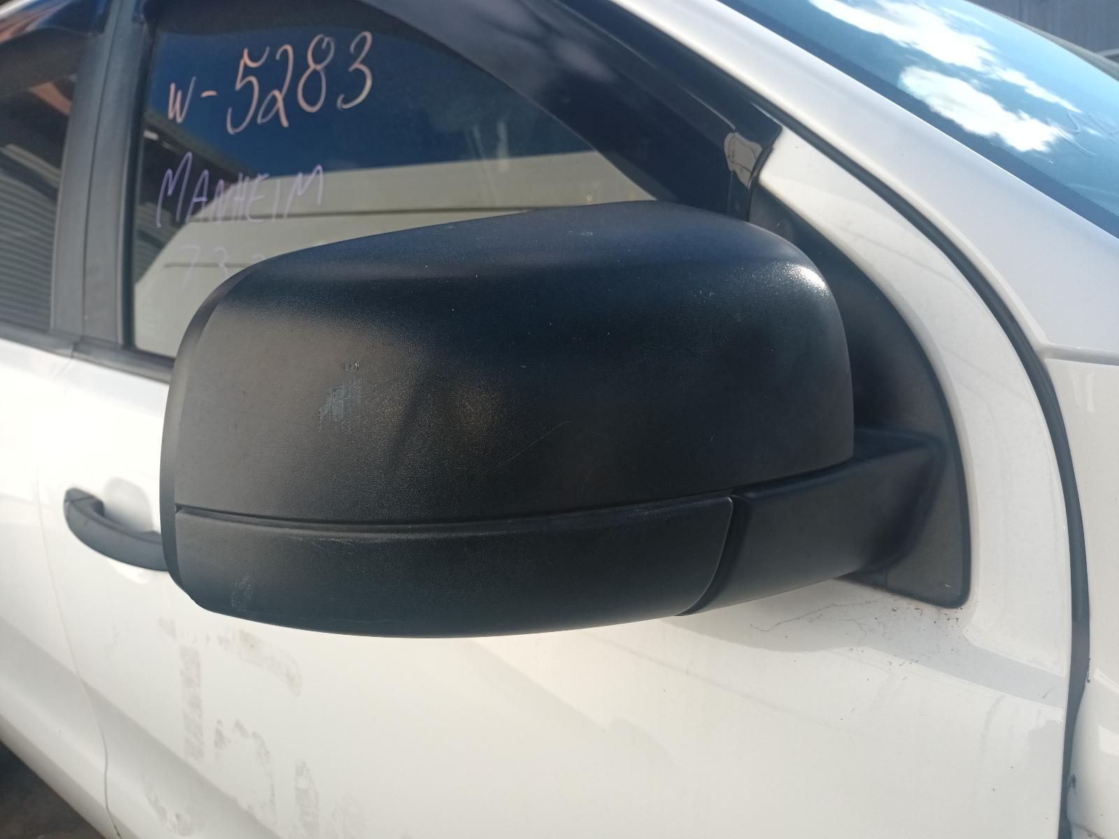 A Black Side View Mirror on a White Car — South West 4WD Wreckers in Harristown, QLD