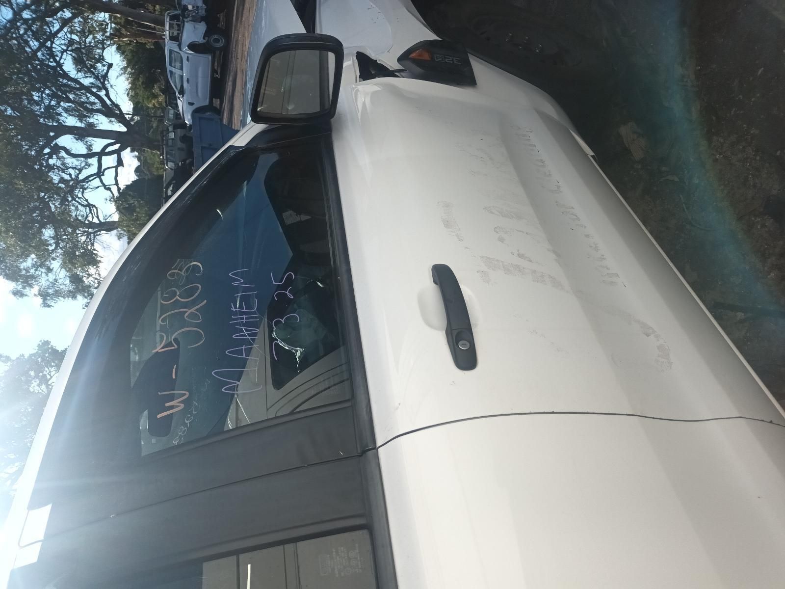 A White Car is Parked on the Side of the Road — South West 4WD Wreckers in Harristown, QLD