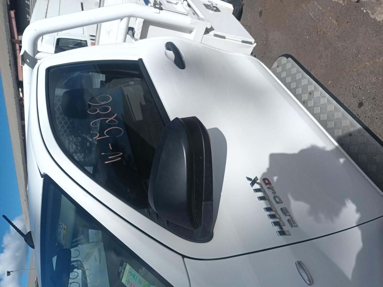 A White Hilux Truck is Parked on the Side of the Road — South West 4WD Wreckers in Harristown, QLD