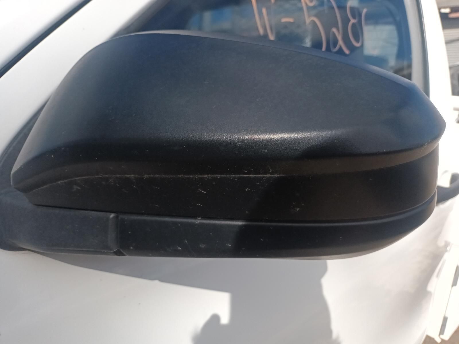 A Close Up of a Side View Mirror on a White Car — South West 4WD Wreckers in Harristown, QLD