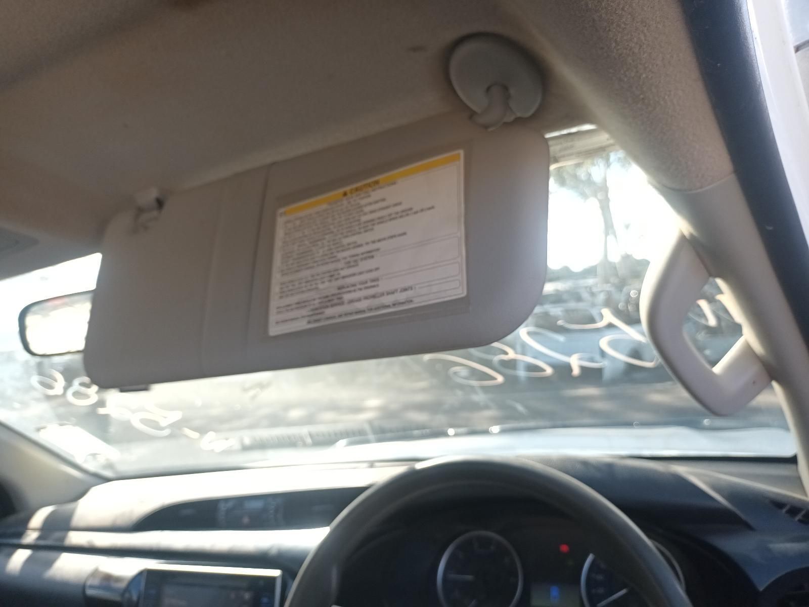A Sun Visor in a Car with a Warning Label on It — South West 4WD Wreckers in Harristown, QLD