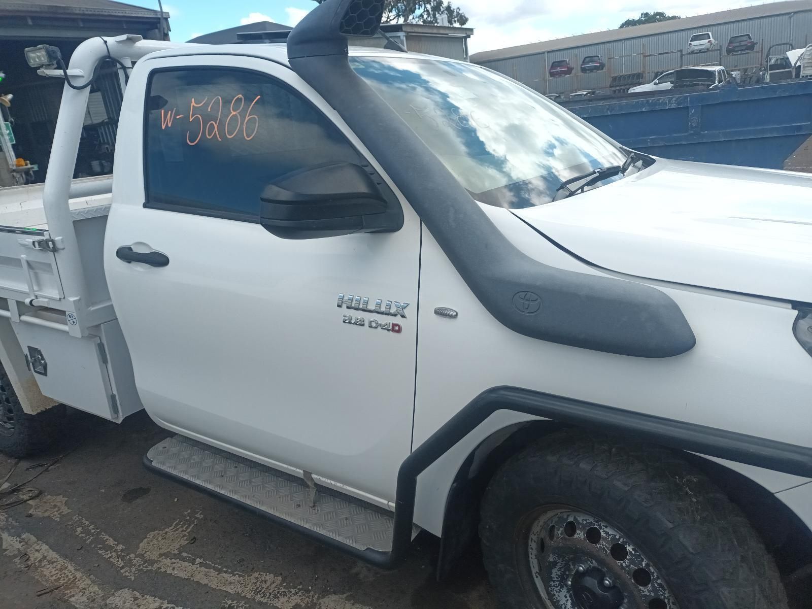 A White Truck with a Snorkel on the Hood is Parked in a Parking Lot — South West 4WD Wreckers in Harristown, QLD