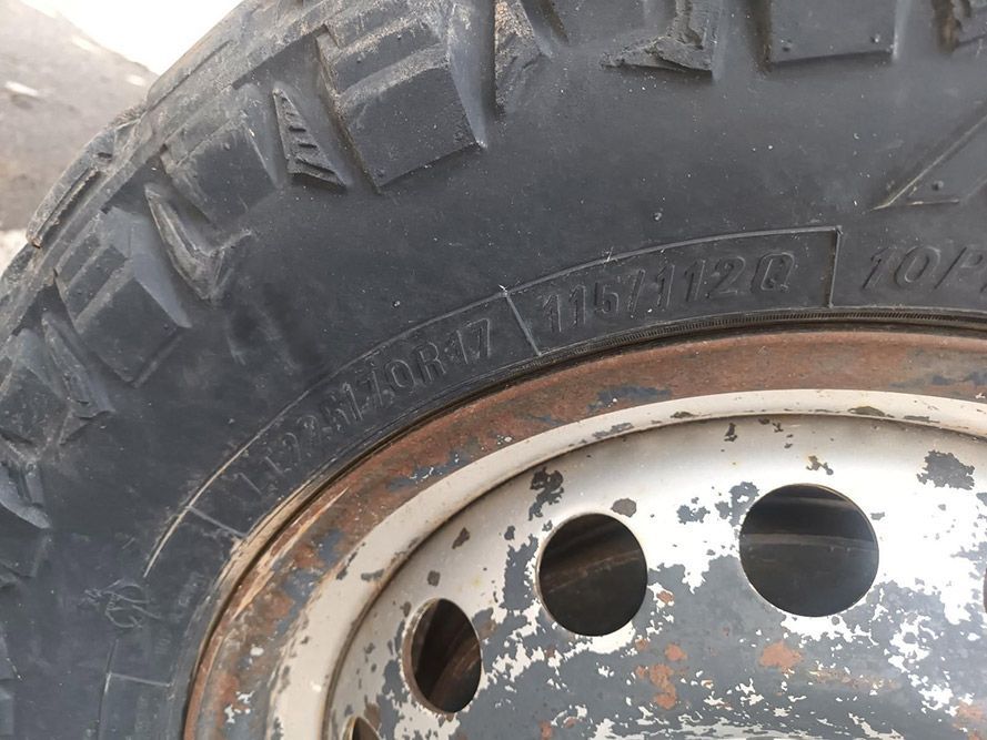 A Close Up of a Tire on a Wheel with Holes in It — South West 4WD Wreckers in Harristown, QLD