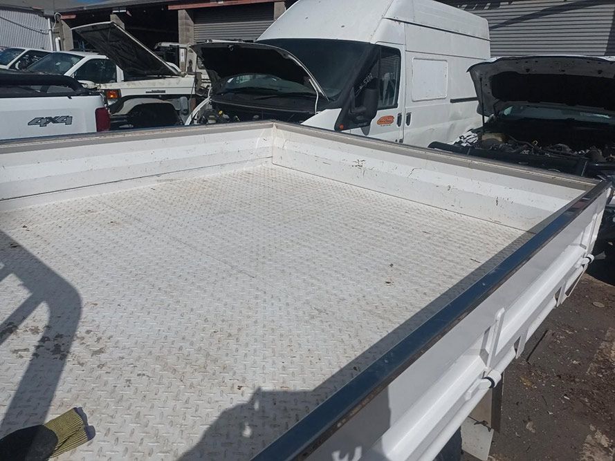 The Back of a White Truck with the Hood Open — South West 4WD Wreckers in Harristown, QLD