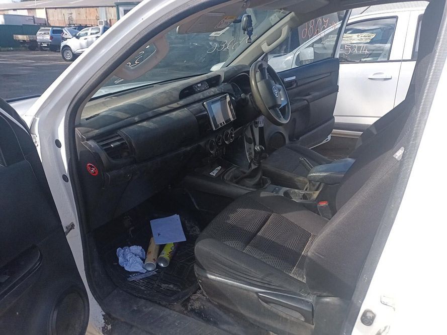 The Inside of a White Car with the Door Open — South West 4WD Wreckers in Harristown, QLD