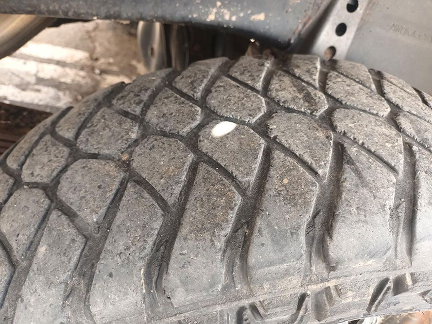 A Close Up of a Tire with a Hole in It — South West 4WD Wreckers in Harristown, QLD