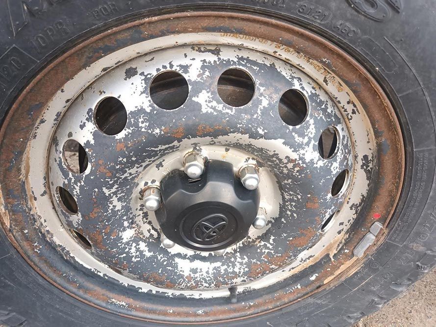 A Close Up of a Wheel with a Toyota Logo on It — South West 4WD Wreckers in Harristown, QLD