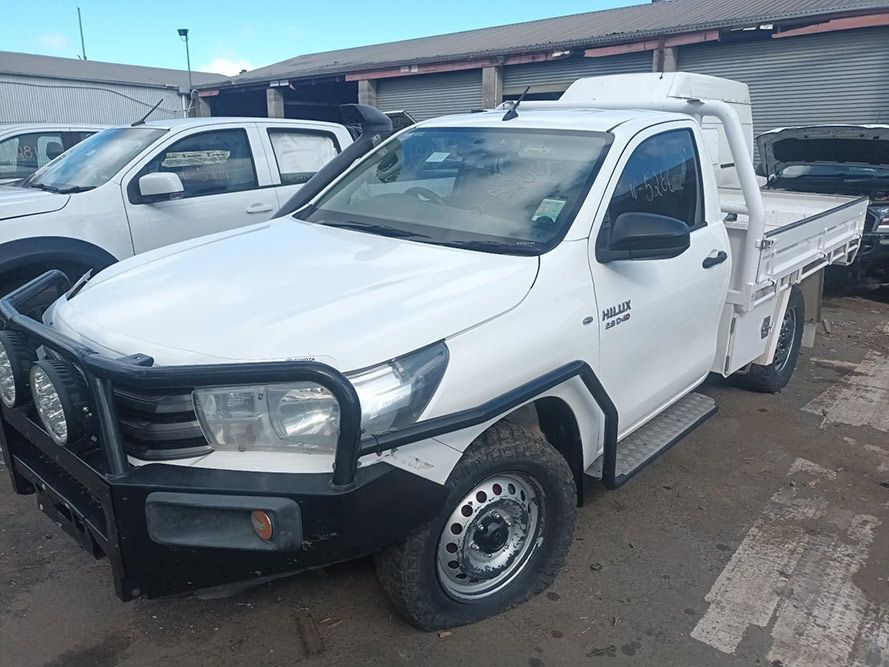 A White Truck with a Black Bumper is Parked in a Parking Lot — South West 4WD Wreckers in Harristown, QLD