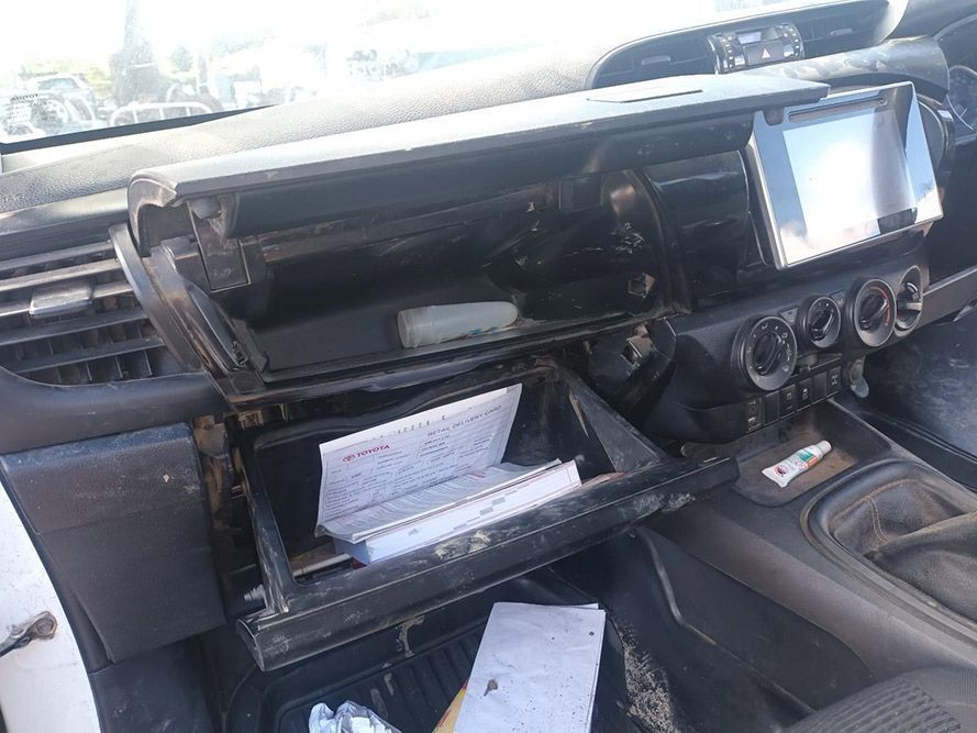 The Dashboard of a Car with the Glove Box Open — South West 4WD Wreckers in Harristown, QLD