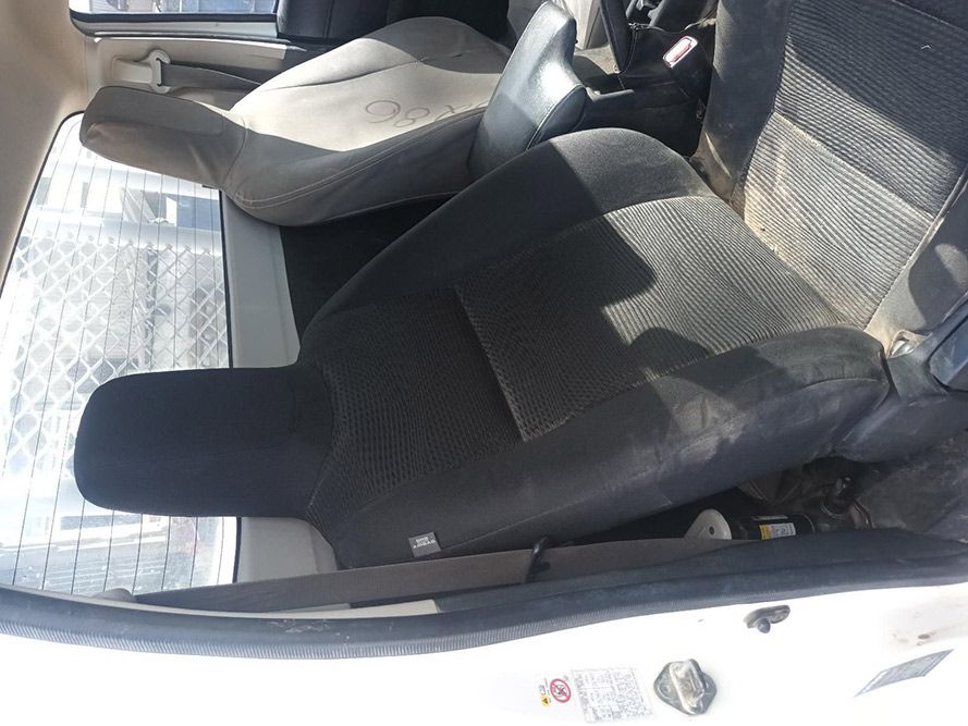 A White Car with Black Seats and a Steering Wheel — South West 4WD Wreckers in Harristown, QLD