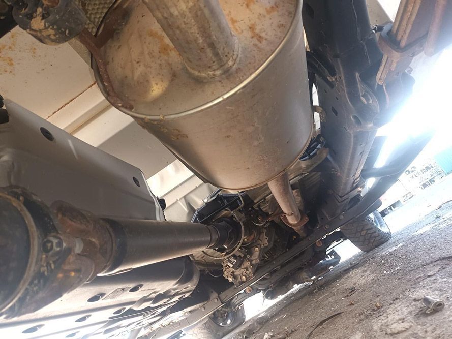 A Close Up of the Underside of a Car with an Exhaust Pipe — South West 4WD Wreckers in Harristown, QLD