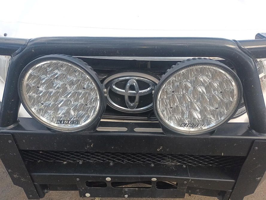 The Front of a White Toyota Truck with a Black Bumper and Lights — South West 4WD Wreckers in Harristown, QLD