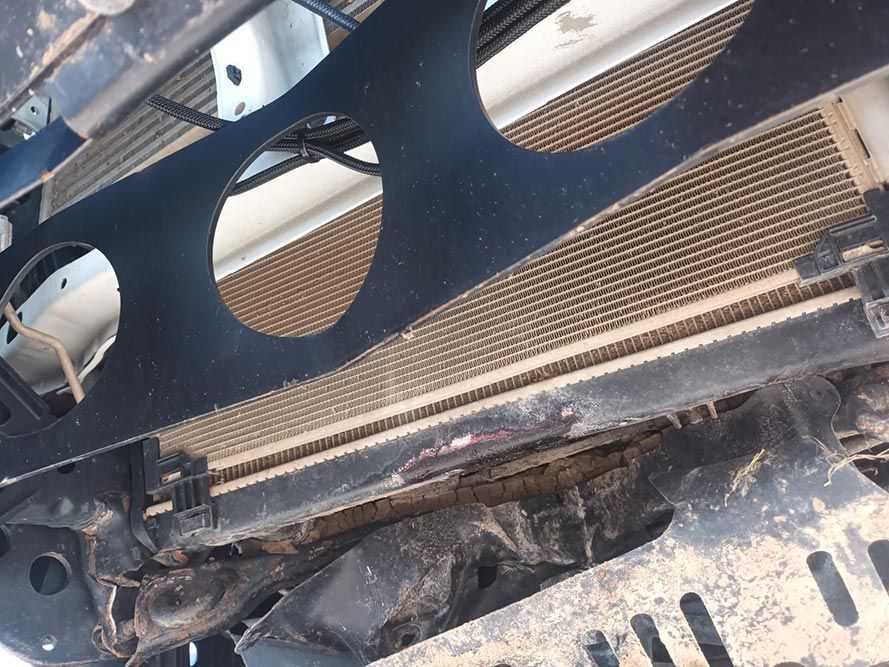A Close Up of a Car Radiator with Holes in It — South West 4WD Wreckers in Harristown, QLD