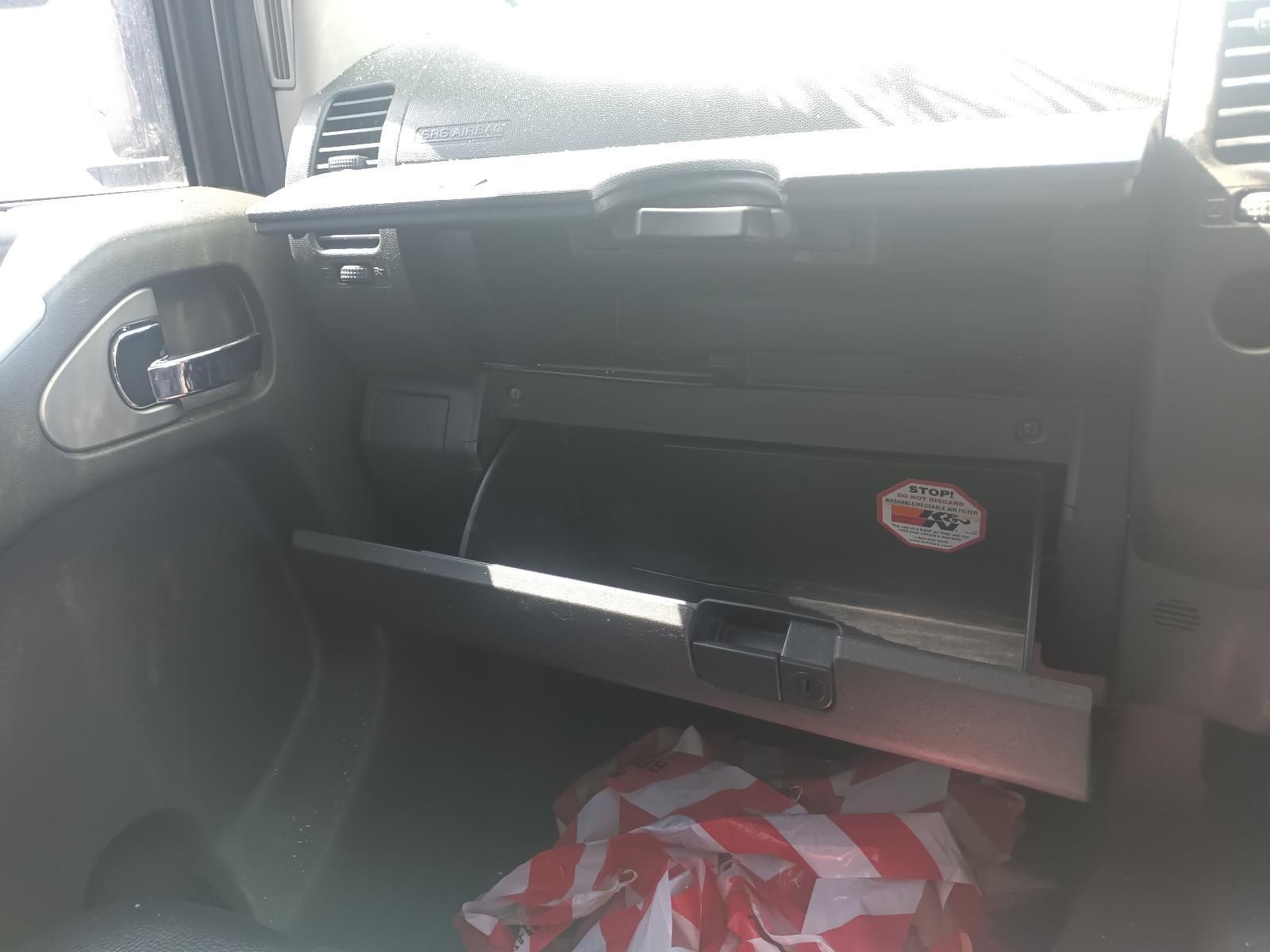 A Glove Box in a Car with a Sticker on It — South West 4WD Wreckers in Harristown, QLD