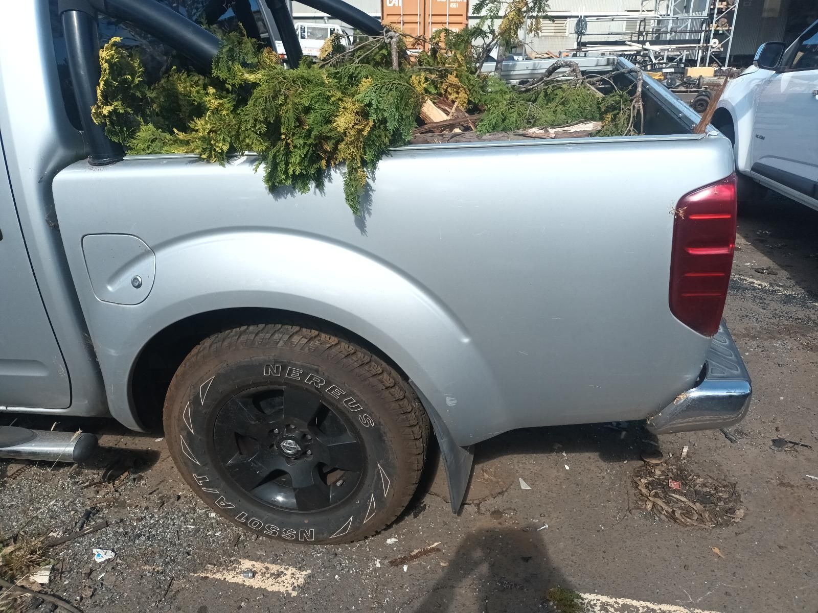 A Silver Truck is Parked on the Side of the Road — South West 4WD Wreckers in Harristown, QLD