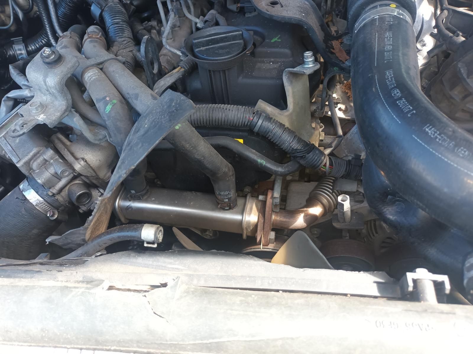 A Close Up of a Car Engine with a Hose Attached to It — South West 4WD Wreckers in Harristown, QLD